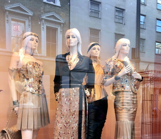'Mannequins in gold outfits with city terraces' photo by A Howse