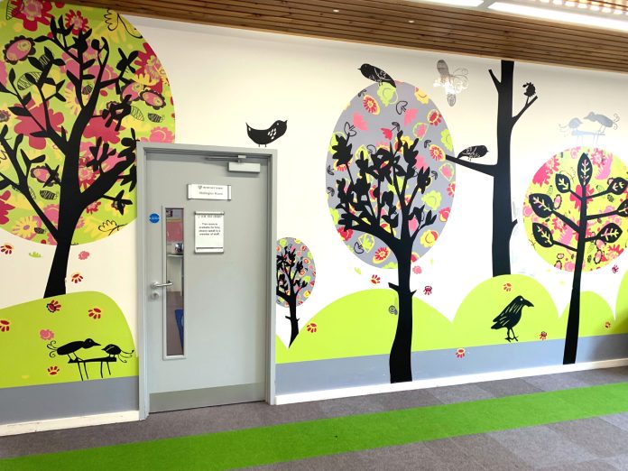 Presentation room door in children's department, public library in Hampshire, UK
