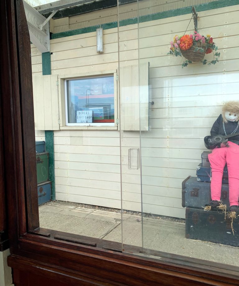 Dereks Gift Shop with 'busker' Scarecrow on Hayling Light Railway platform, Hampshire, England. Image by A. Howse