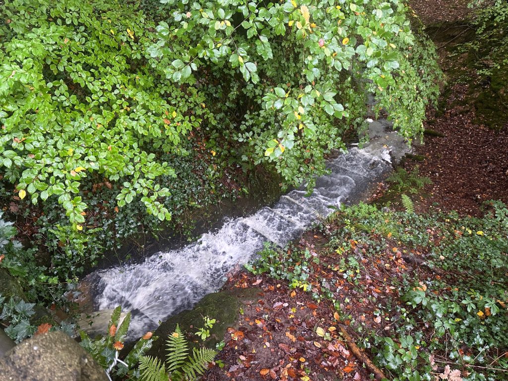Stream water gushes in Fernhurst Surrey. Photo by A.Howse