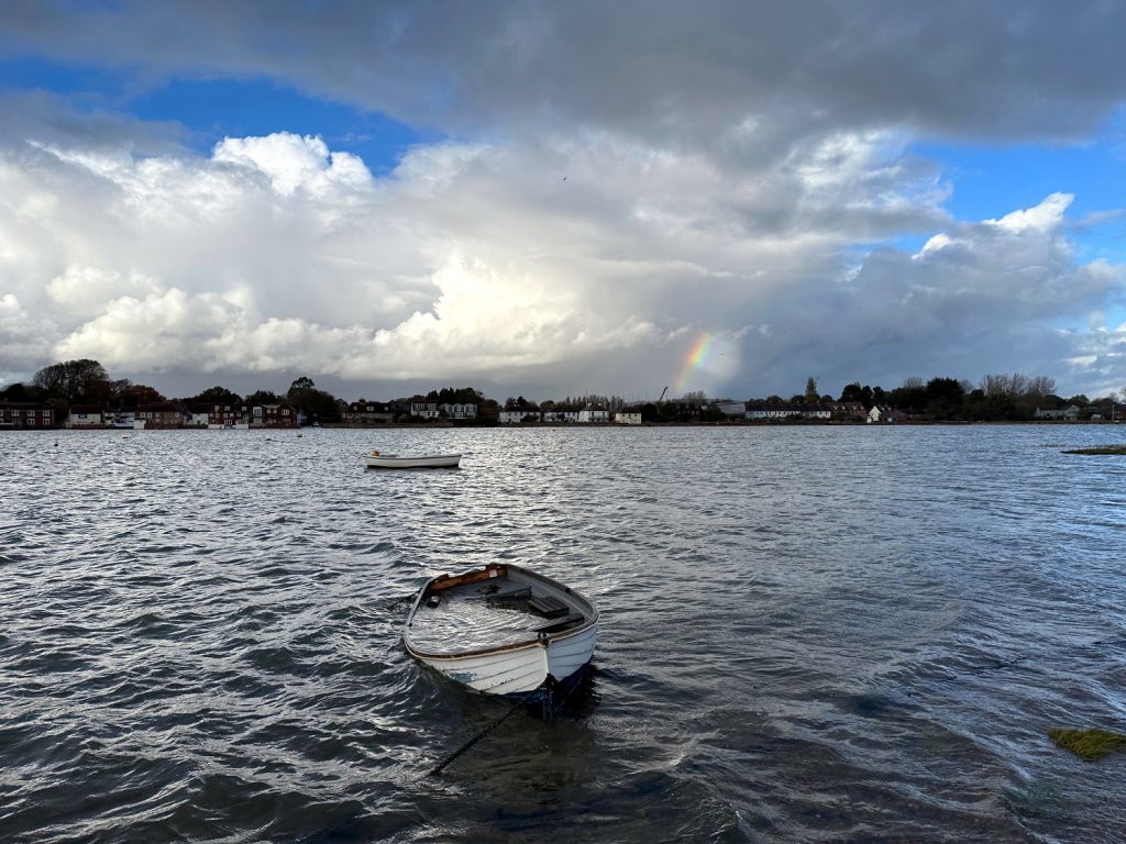 Boat floods, rainbow on horizon, Chichester harbour, Photo by A.Howse